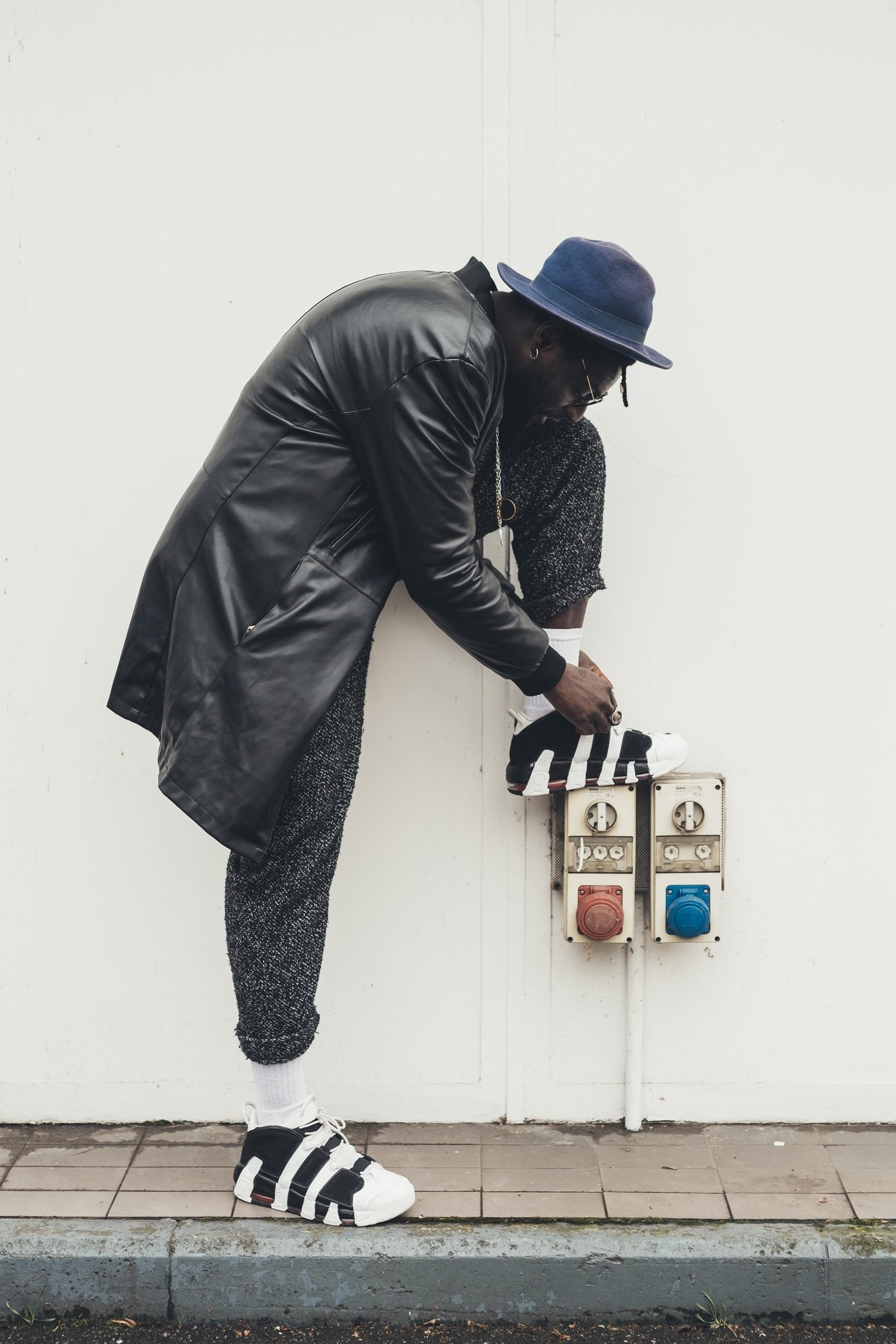 young african man tying his shoes